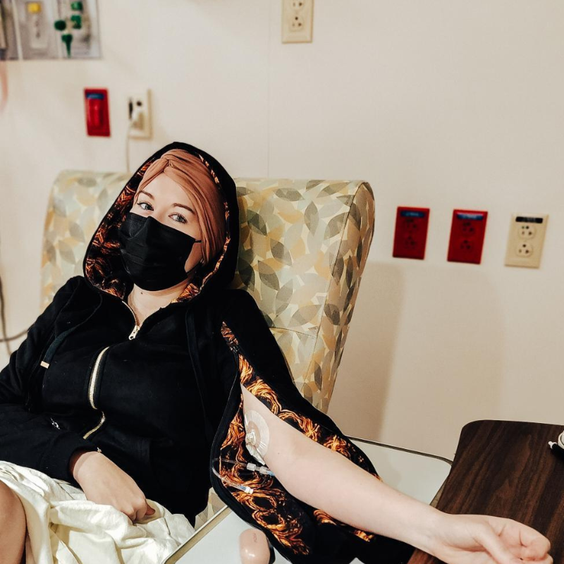 Patient wearing IV Hoody, showing PICC Line access.