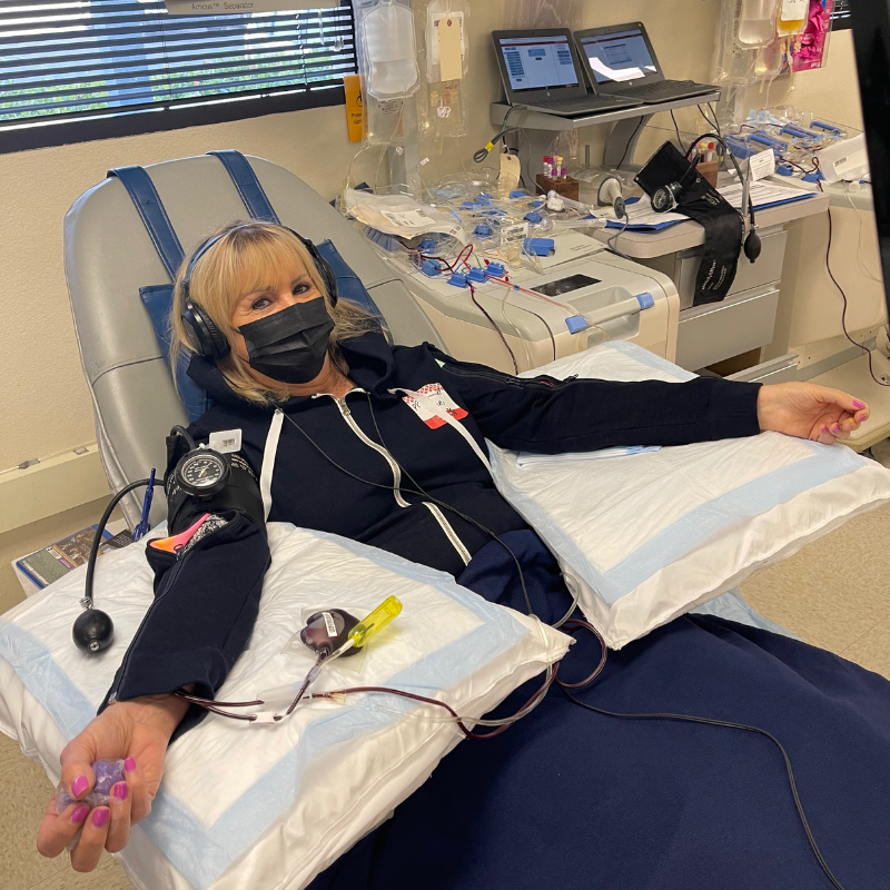 Patient wearing Denim in Sunshine IV Hoody while donating blood platelets.  She is nice and warm while she is giving blood.